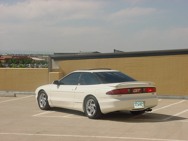 White 1996 Ford Probe GT parked in a lot, rear 3/4 view