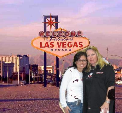 1993 Ford Taurus - Two women pose for a photo in front of the famous Las Vegas sign with city buildings in the background.