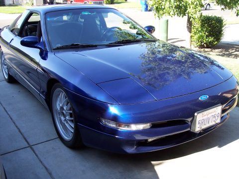 1995 Ford Probe - Front 3/4 view of a blue 1995 Ford Probe with a California license plate.