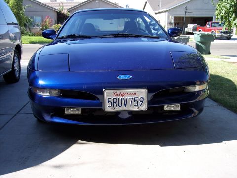 1995 Ford Probe - Front view of a blue 1995 Ford Probe parked in a driveway.