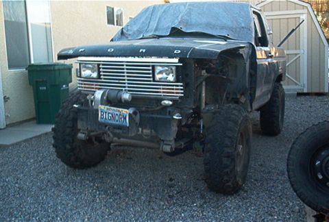 1986 Ford Bronco - This modified Ford Bronco shows significant damage and missing body panels.