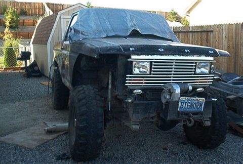 1986 Ford Bronco - This black Ford truck, possibly from the early 1980s, features a prominent winch and a custom Nevada license plate.
