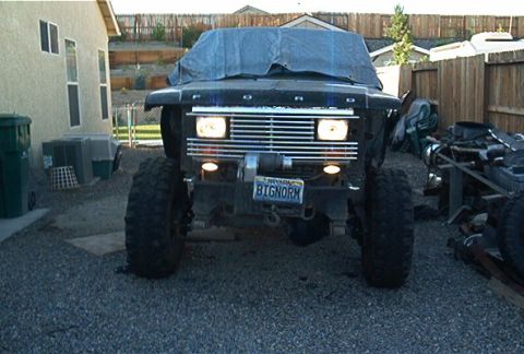 1986 Ford Bronco - Front view of a 1986 Ford Bronco, modified with a winch and custom plate.