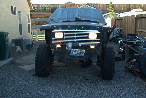 1986 Ford Bronco front end, grille, headlights, winch, and Nevada license plate reading BIGNORM