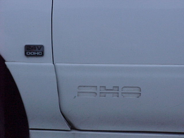 Side panel of a 1994 Ford Taurus SHO with 24V DOHC badge
