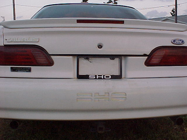 White Ford Taurus SHO rear with a spoiler and SHO badging