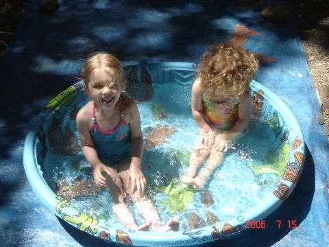 1993 Ford Bronco - Children enjoy a summer day in a small inflatable pool.