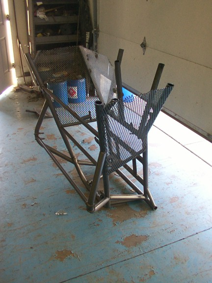 1978 Ford Bronco - Unfinished custom metal fabrication project, possibly a vehicle chassis or roll cage, in a garage setting.