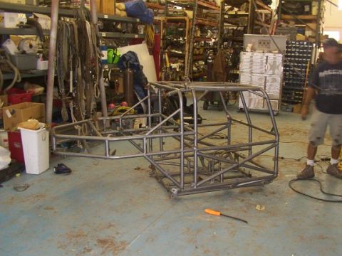 1978 Ford Bronco - A custom tube chassis is suspended in a workshop, awaiting further modifications.