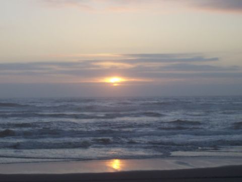 1994 Ford F-150 - A ocean sunset over wavy waters, with the Supermotors.net logo visible in the lower right corner.