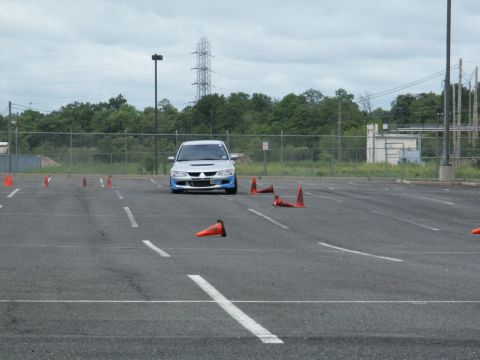 2001 Mercury Grand Marquis - A silver Mitsubishi Lancer Evolution VIII navigates a course marked by traffic cones in an asphalt lot.