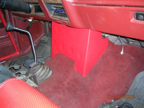1985 Ford Bronco - Interior view of a 1985 Ford Bronco, highlighting the floor shifter and custom red console.