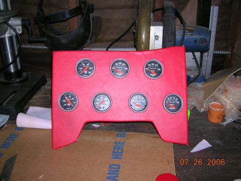 1985 Ford Bronco - A red gauge cluster with multiple gauges is shown, likely for installation in a vehicle. The date stamp indicates it was photographed on Ju…