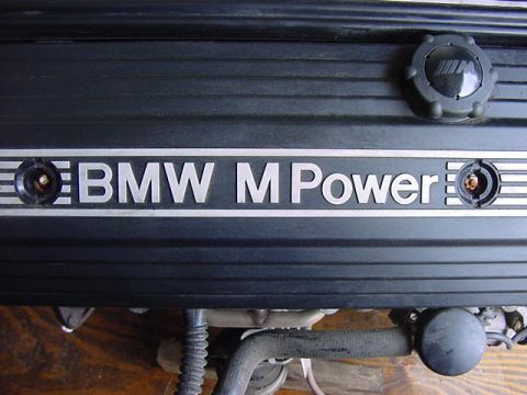 1984 BMW 3 Series - Close-up of a BMW M Power engine cover, showing the branding and an oil cap.