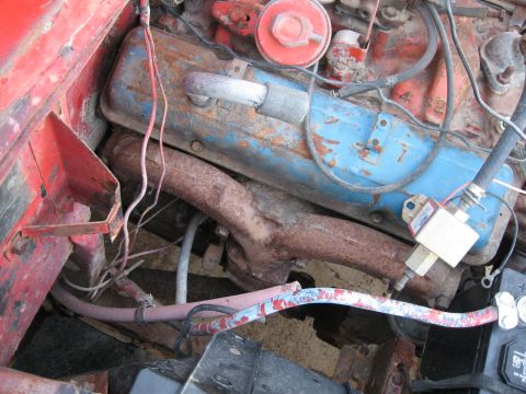 1983 Chevrolet Silverado 1500 - The engine bay shows significant rust and wear on various components.