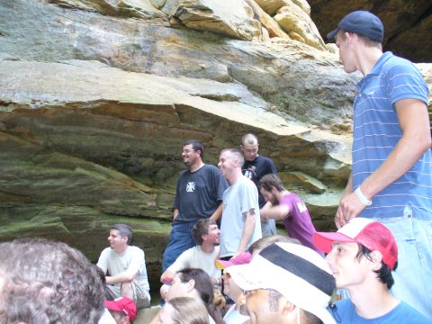 1991 Ford Probe - People are gathered in front of a large rock formation, with a watermark for "SUPERMOTORS" visible at the bottom right.