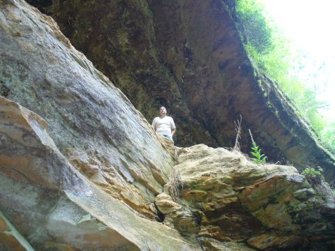 1991 Ford Probe - A person is positioned on a rock formation in a natural outdoor setting.