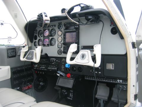 1989 Ford Bronco - The interior of a small aircraft shows a complex dashboard with multiple instruments and controls.