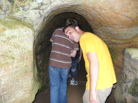 1991 Ford Probe - Visitors explore a natural cave formation, with one person resting their head on another's shoulder.