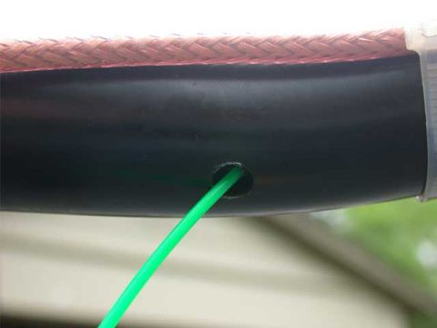 1996 Ford Bronco - And here is the bottom hole, after pulling the "snake" through. I used a Snap On, hook tool to jimmy that line out the hole. It was a bit t…