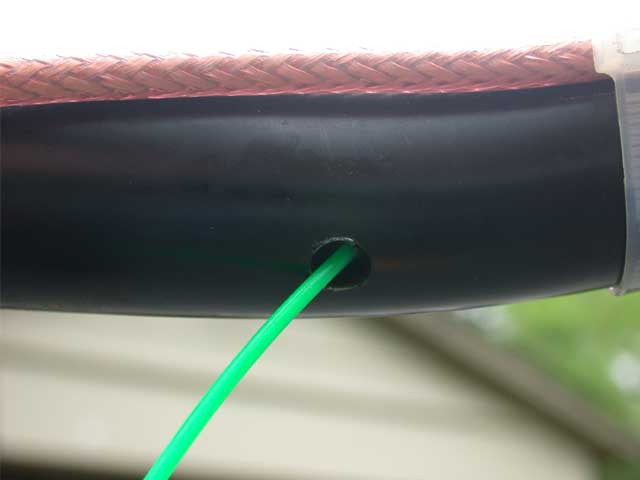 And here is the bottom hole, after pulling the "snake" through. I used a Snap On, hook tool to jimmy that line out the hole. It was a bit tricky. Patience....