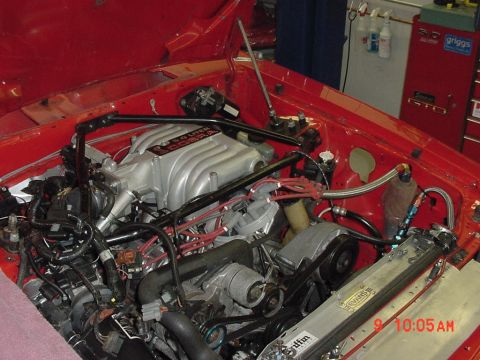1993 Ford Mustang - The engine bay of a 1993 Ford Mustang Cobra features a 5.0 liter intake and a Griffin radiator.