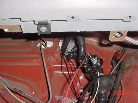 1993 Ford Mustang - Close-up of a vehicle's interior wiring harness, showing a complex network of wires and connectors.