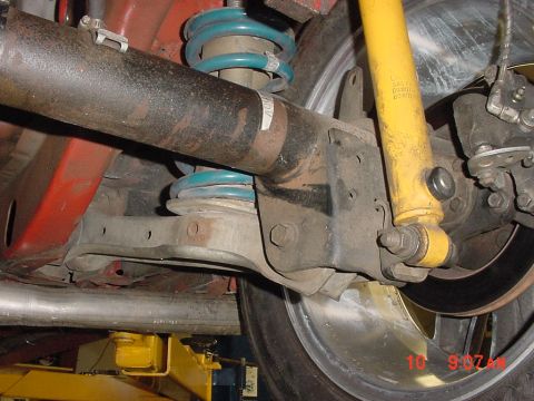 1993 Ford Mustang - Underside view of a vehicle's rear suspension system, showing shocks, springs, and exhaust.