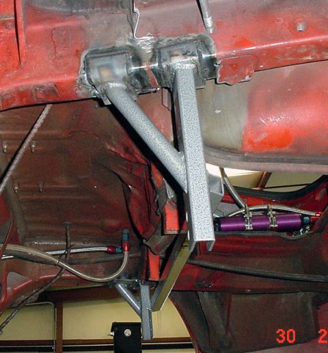 1993 Ford Mustang - Custom underbody chassis modifications are visible, including a purple fuel filter and braided fuel lines.