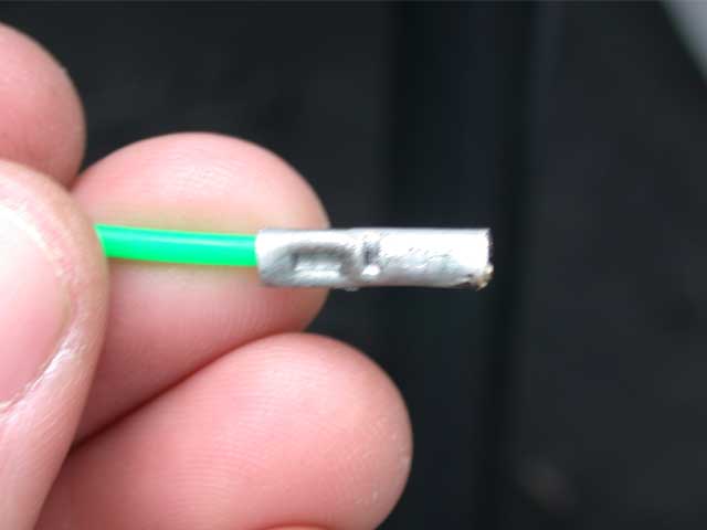 Insert the "snake" end into one side of the crimp connector, and with your crimp tool, make sure you have a successful bite.
