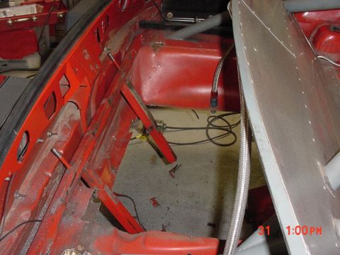 1993 Ford Mustang - Car interior being modified with exposed metal and fuel lines visible.