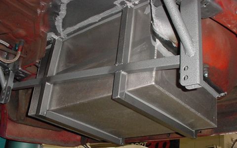1993 Ford Mustang - Underside view of a custom fuel tank installation with metal support structure.