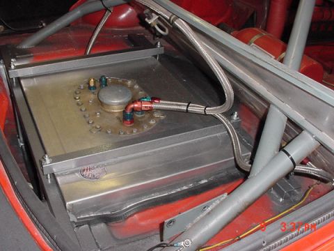 1993 Ford Mustang - Custom racing fuel cell installed in a vehicle's interior, surrounded by roll cage tubing.