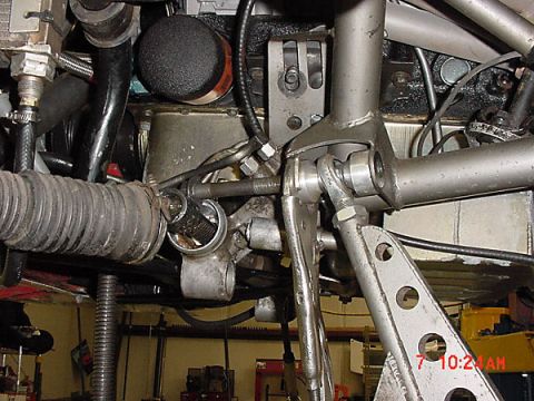 1993 Ford Mustang - Underneath view of automotive steering and suspension parts, likely during repair.