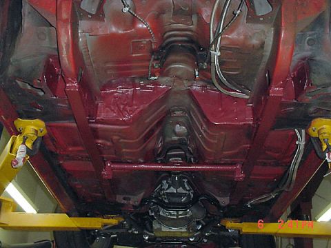 1993 Ford Mustang - Underbody view of a 1993 Ford Mustang, showing the painted frame and transmission.