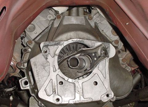 1993 Ford Mustang - The transmission bell housing of a vehicle is shown, with a part number visible on the casing.