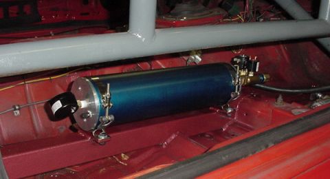 1993 Ford Mustang - A blue air tank with a gauge and valve is installed in the interior of a car, likely for a custom modification or racing setup.