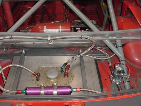 1993 Ford Mustang - Custom fuel system and safety equipment installed in the rear of a modified vehicle.