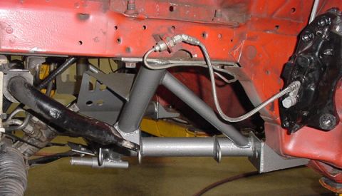 1993 Ford Mustang - Close-up view of automotive suspension components, likely from the front end of a vehicle.
