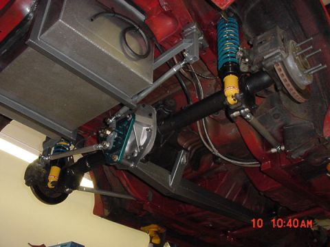 1993 Ford Mustang - Custom rear axle and suspension modifications are visible, including an aftermarket fuel tank and coilovers.