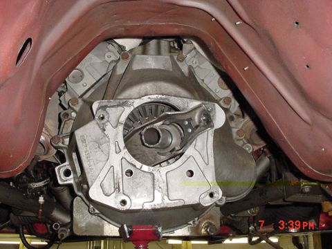 1993 Ford Mustang - Transmission bell housing and clutch components visible from underneath a vehicle.