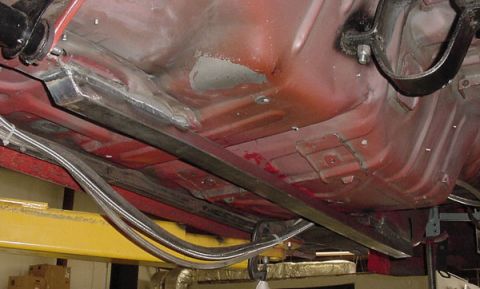 1993 Ford Mustang - Underbody view of a 1993 Ford Mustang with added frame reinforcement and brake lines.