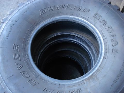 1994 Ford Bronco - A stack of Dunlop Radial Rover tires is visible, with one tire showing the size 35x12.50R17.