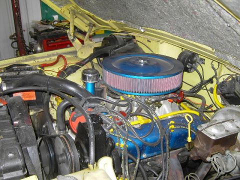 1977 Jeep Wagoneer - Close-up view of a vehicle's engine bay, showing various components and wiring.
