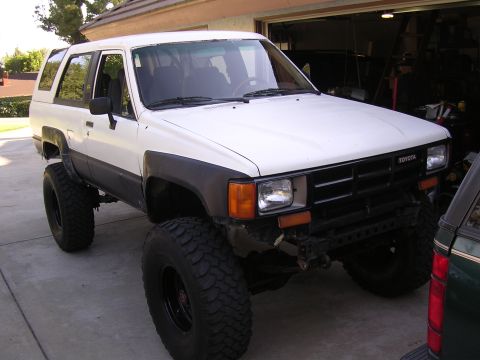 1985 Toyota 4Runner - This modified Toyota 4Runner features a lifted suspension and oversized tires, suggesting a model year around 1984.