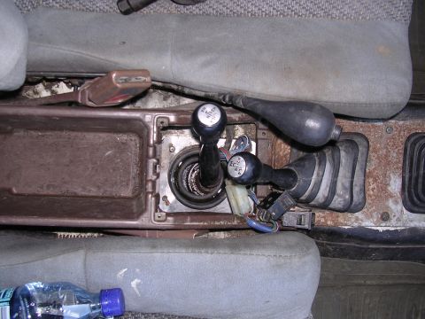 1985 Toyota 4Runner - The interior of a 1985 Toyota 4Runner shows the dual-stick transfer case and gear shifter, indicating its four-wheel-drive capability.