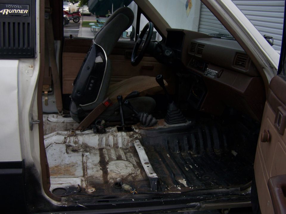 Toyota 4Runner interior stripped to bare floor pans with shifter and transfer case levers
