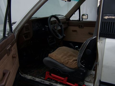 1985 Toyota 4Runner - Interior view of a 1985 Toyota 4Runner, with a visible badge on the exterior pillar.