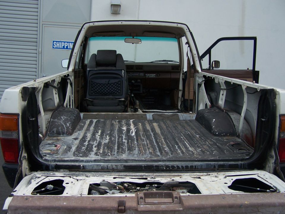 Gutted Toyota 4Runner cargo bay with top and rear seat removed, tailgate open