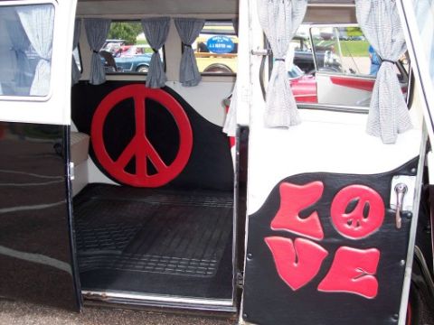 1972 Ford Ranchero - The interior of a van features a large peace sign and the word 'LOVE' in red lettering.